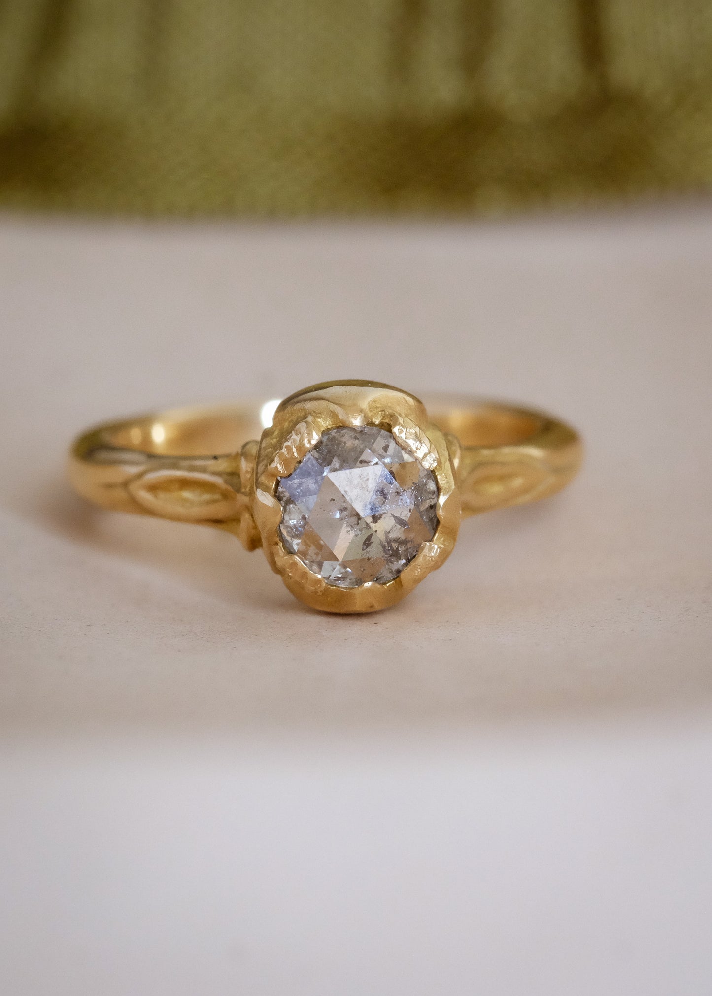 Taking its cue from nature, the Sepal ring captures the intricacy of layered flower petals rendered in gold, revealing a precious rose cut diamond—a refined piece that’s as timeless and beautiful as the botanical world.
