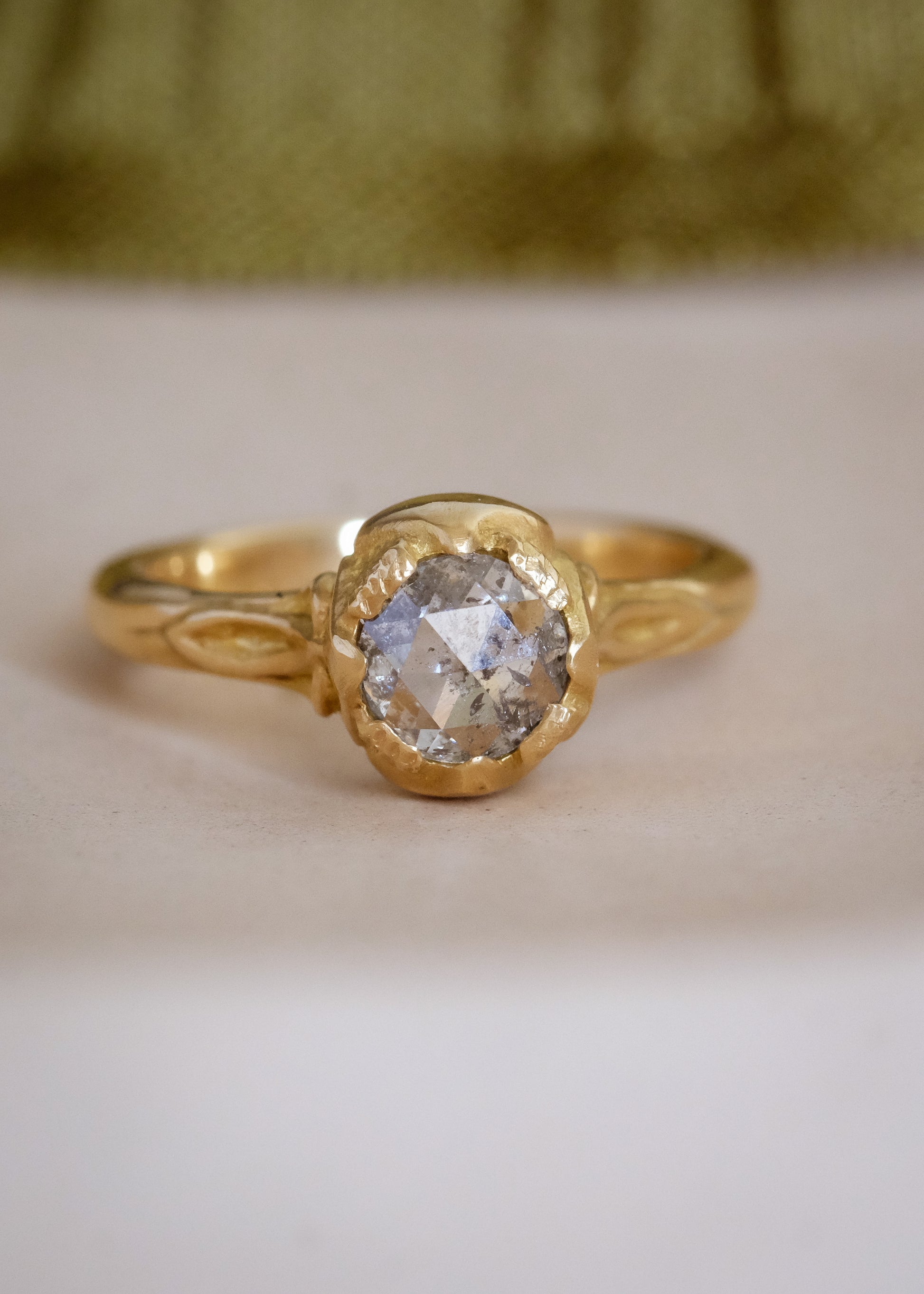 Taking its cue from nature, the Sepal ring captures the intricacy of layered flower petals rendered in gold, revealing a precious rose cut diamond—a refined piece that’s as timeless and beautiful as the botanical world.