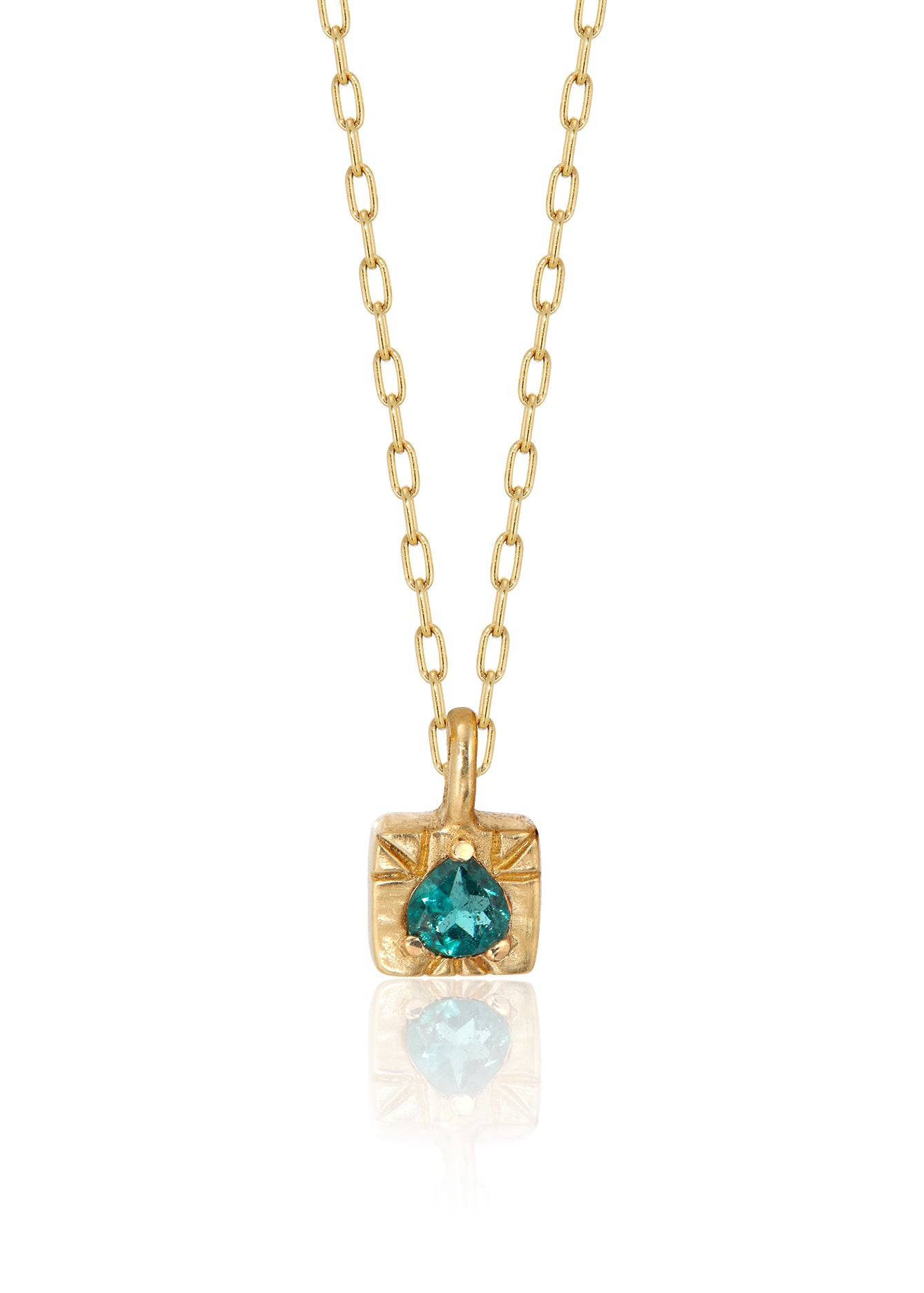 The fire of inspiration ignites with a single spark. Named after the Greek goddess of the hearth, the Vesta necklace features an engraved box-shaped gold charm with a tourmaline stone that glimmers like sacred embers–a piece that glows with promise and warmth.