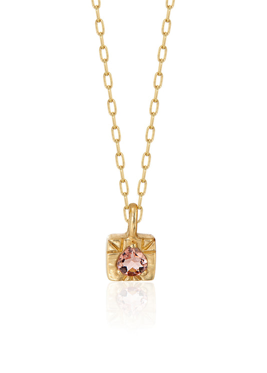 The fire of inspiration ignites with a single spark. Named after the Greek goddess of the hearth, the Vesta necklace features an engraved box-shaped gold charm with a tourmaline stone that glimmers like sacred embers–a piece that glows with promise and warmth.