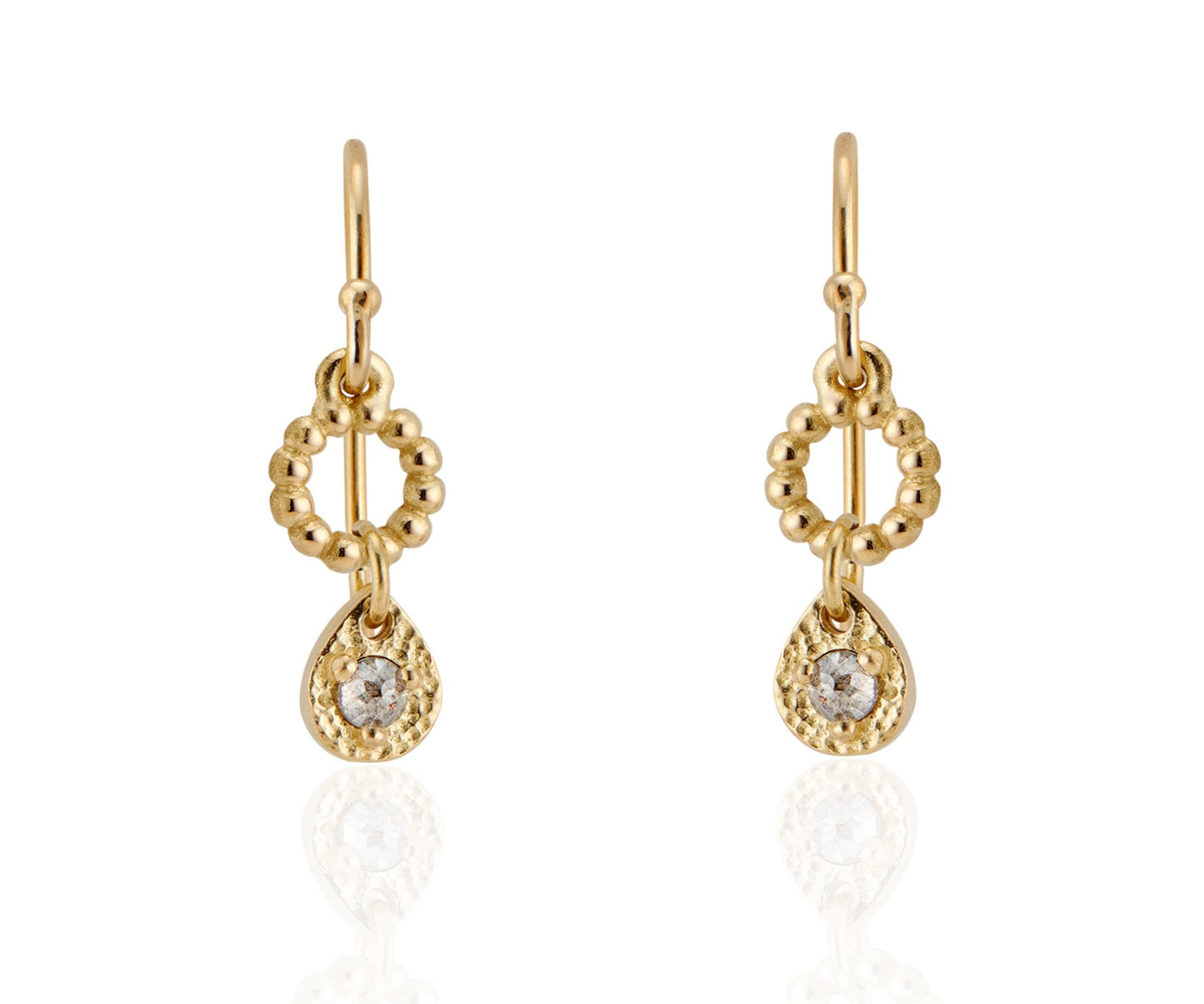 A romantic journey that transcends time. The Drop earring merges a circle of understated gold beads with ornate rose cut diamonds for a dangling romantic style that feels as at home today as it does in an antique jewelry box. 