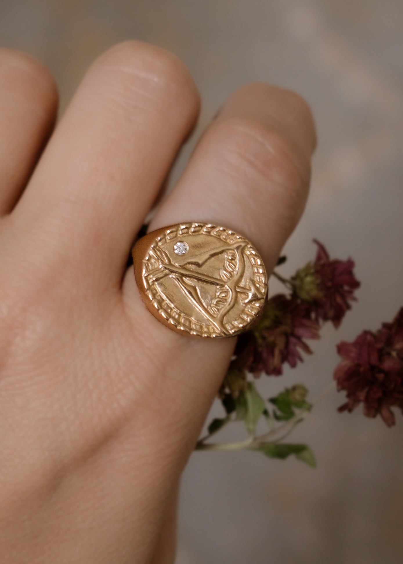 The ninth sign of the Zodiac, fire sign Sagittarius is a passionate traveler whose natural curiosity ignites their adventures. A hand-detailed bow and arrow is accented with a precious diamond for a ring that captures the power of the celestial sky.
