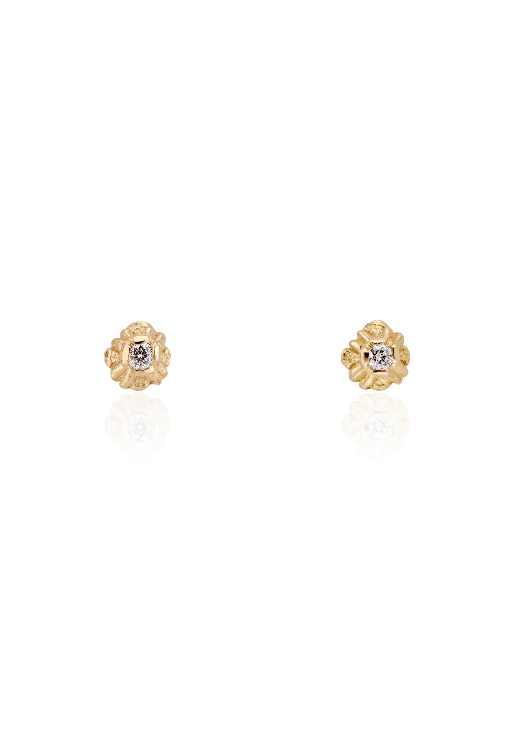 Evocative of a flower turning its face to the last kiss of golden hour sun, the Sorrel earring radiates warmth and botanical beauty. Hand-carved stud earrings are accented with brilliant diamonds, a timeless and romantic style favored for everyday wear. 
