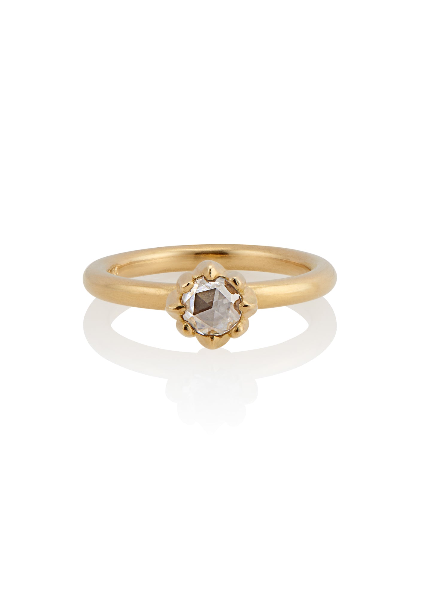 In simplicity, majesty is revealed. Inspired by the stark and graphic botanical photographs of Karl Blossfeldt, the Fleur ring creates a striking silhouette on the finger, its clean gold band showcasing a regal and romantic rose cut diamond. 