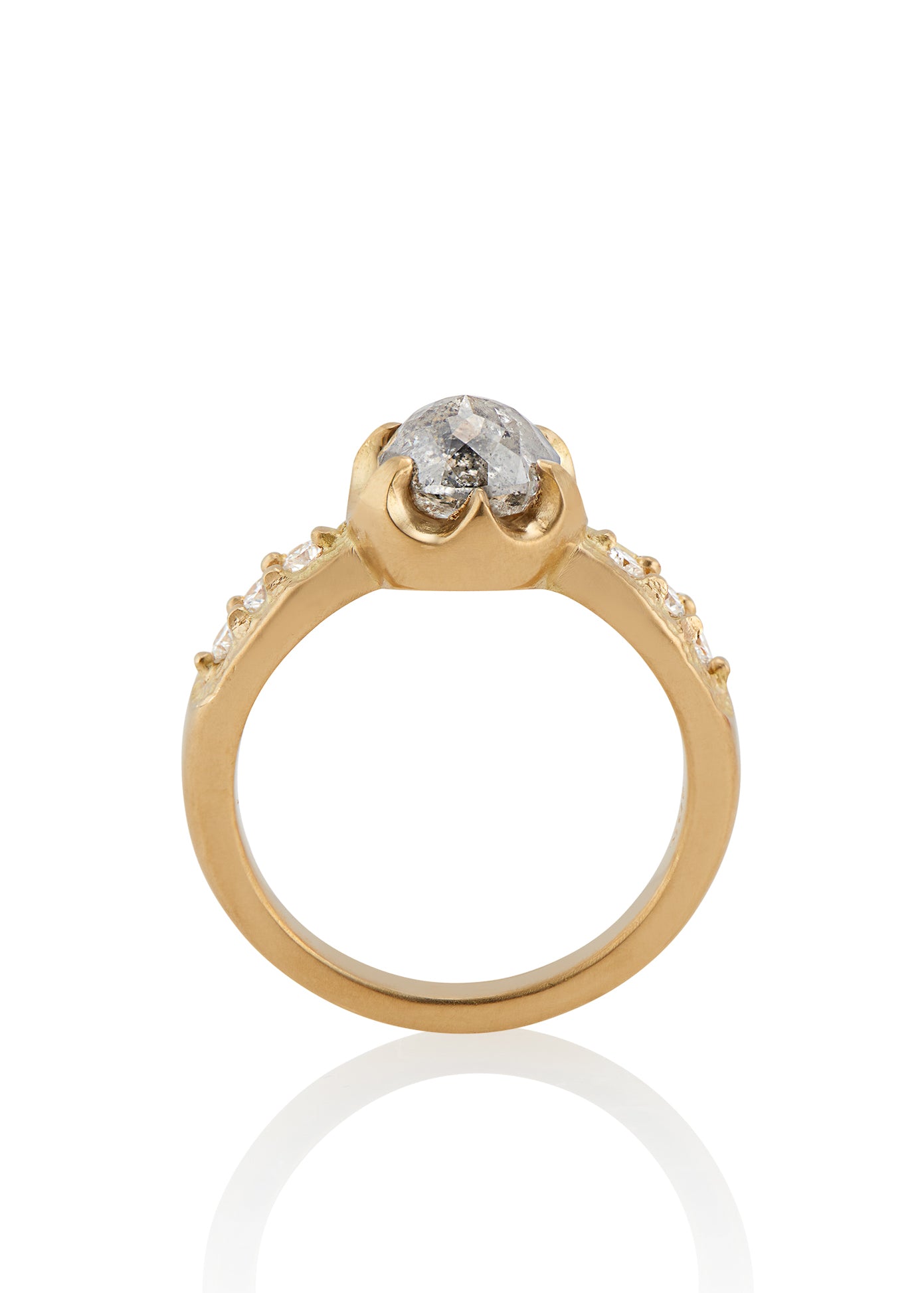 Inspired by the mesmerizing solo by musician Maxence Cyrin, the Gradiva ring embodies both the resonant chords and whimsical trills of the piano in a piece that marries substance with ethereal beauty. Brilliant inlaid diamonds adorn the band of the ring as a precious rose cut diamond sits prominently within the gold prongs—an heirloom-worthy ring to be cherished for generations.