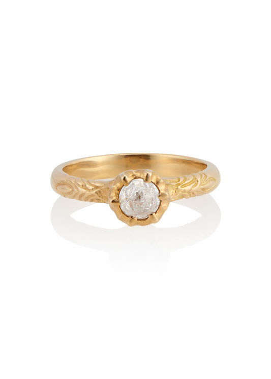 Like the haunting notes of a Glenn Miller Orchestra record, the Perfidia ring ascends to prominence on the finger to captivate all who bear witness to such beauty. Delicate details on the gold band give way to a textured pattern that holds a rose cut diamond, an exquisite work of ornate craftsmanship. 