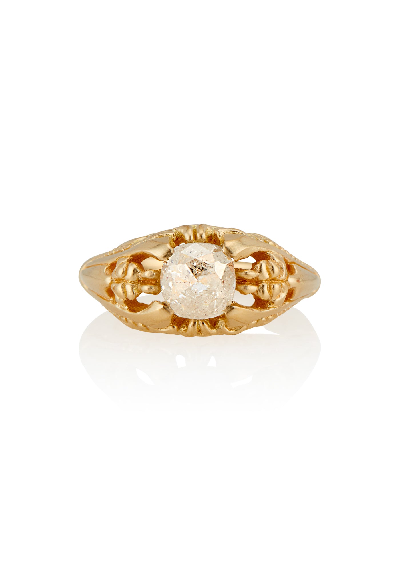 Capturing the ornate details of the Victorian era, the Violette ring was inspired by the love between Prince Albert and Queen Victoria. A substantial gold band is rich in intricate detail, showcasing craftsmanship with each bead, curve and open space. A stunning rose cut diamond sits flush among the prongs, creating a romantic ring to cherish for the ages. 