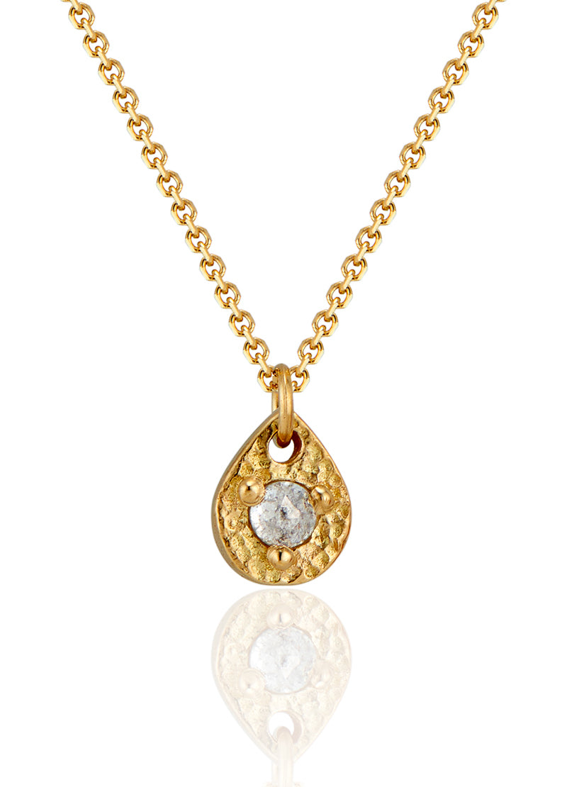 A romantic journey that transcends time. The Drop necklace merges a circle of understated hand-carved gold beads with ornate rose cut diamonds for a dangling romantic style that feels as at home today as it does in an antique jewelry box. 