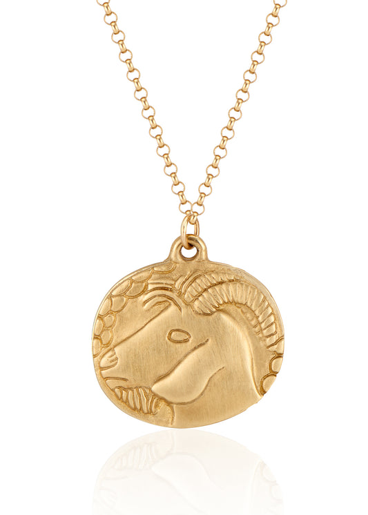 The tenth sign of the Zodiac, Earth sign Capricorn is fiercely independent and responsible, grounded in reality that they can mold to their will. A hand-carved, moody bearded goat creates a necklace that captures the power of the celestial sky.
