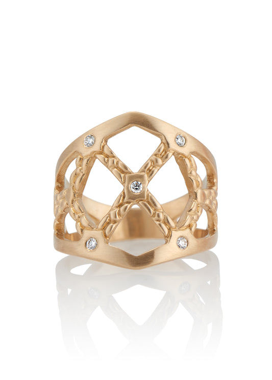 Named for the Norse goddess of love, gold and beauty, the Freya ring encapsulates fierce strength and unparalleled magnificence. Gold bands, both smooth and textured, criss cross around the finger to create open space—an architectural aegis highlighted by sparkling diamonds. 