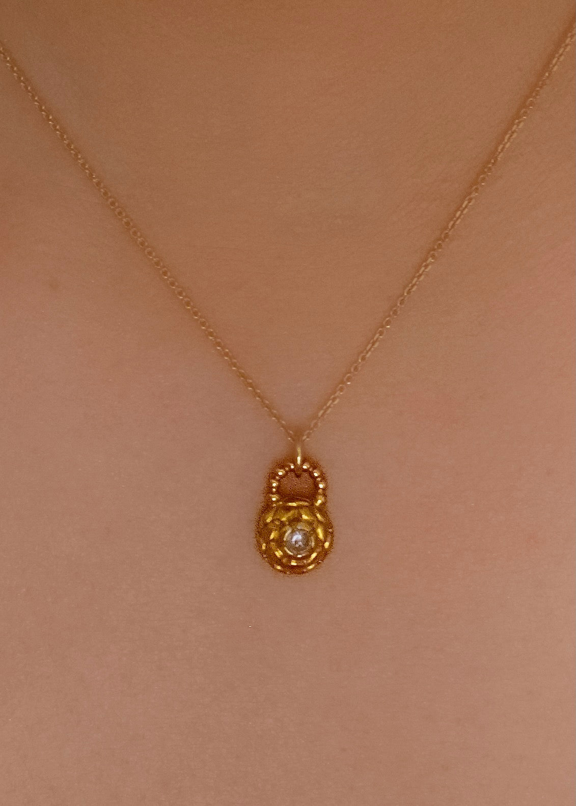 Featuring intricate hand-carved beads that center around a brilliant rose cut diamond, the Marquis necklace is fit for royalty and reimagined for everyday wear. 