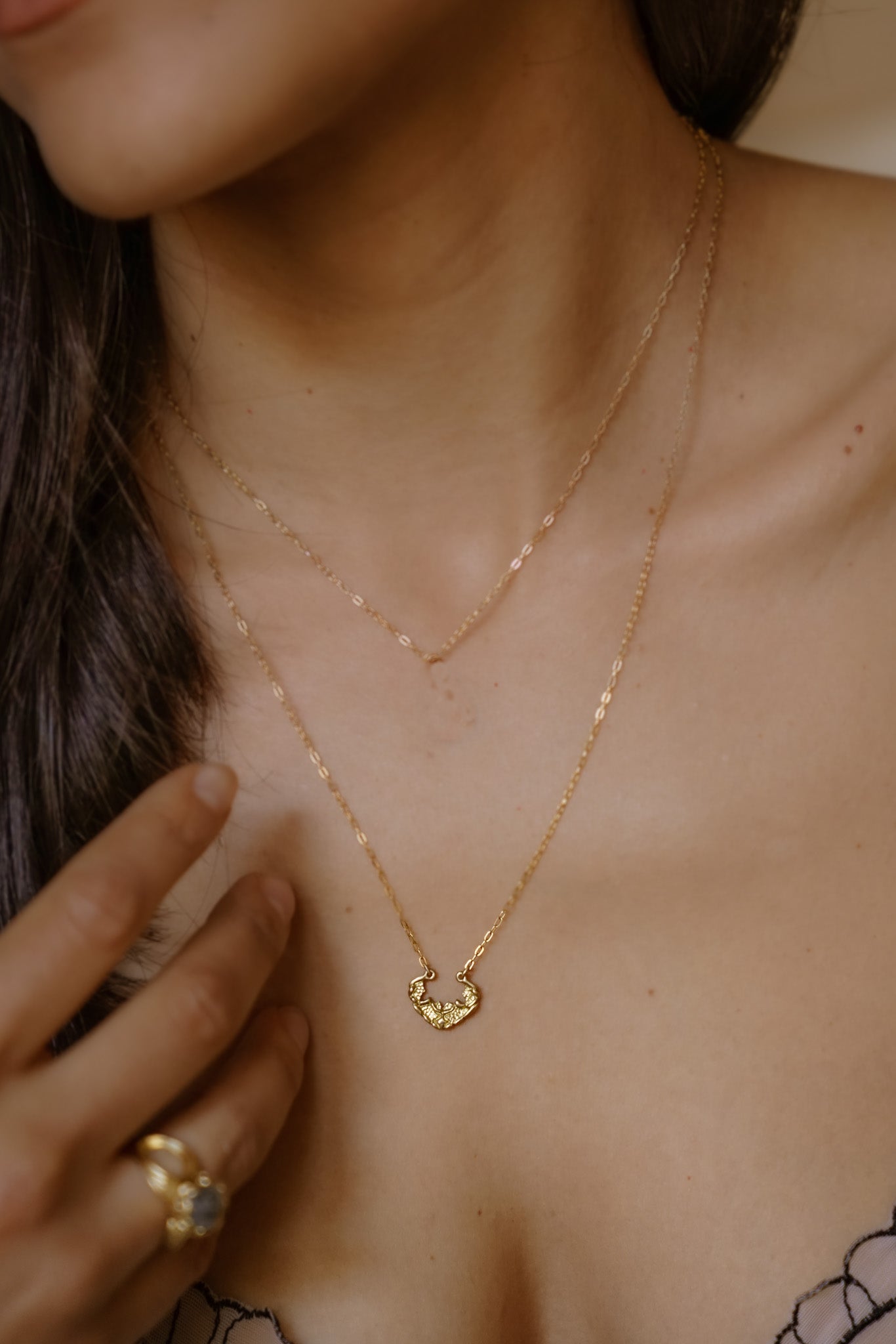 Named for the goddess of the sea, the Sedna necklace mirrors the undulating rhythm of the ocean. Gold waves expand and recede, revealing detailed texture that invites the eye to linger—a piece evocative of infinite strength and power. 