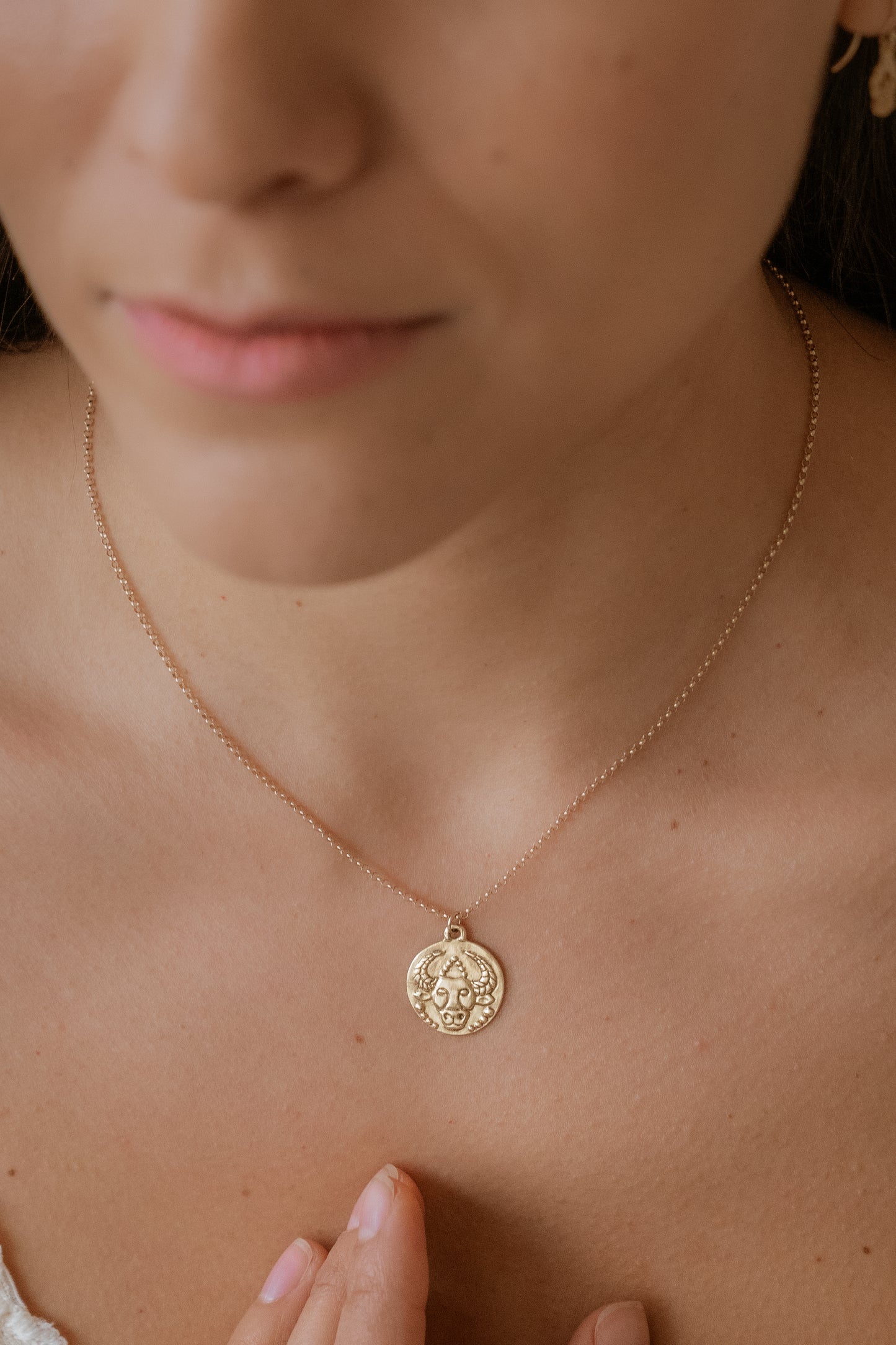 The second sign of the Zodiac, Earth sign Taurus seeks beauty and gives love fearlessly. A hand-carved bull, spiritual and wise, graces this pendant—creating a necklace that captures the power of the celestial sky. 
