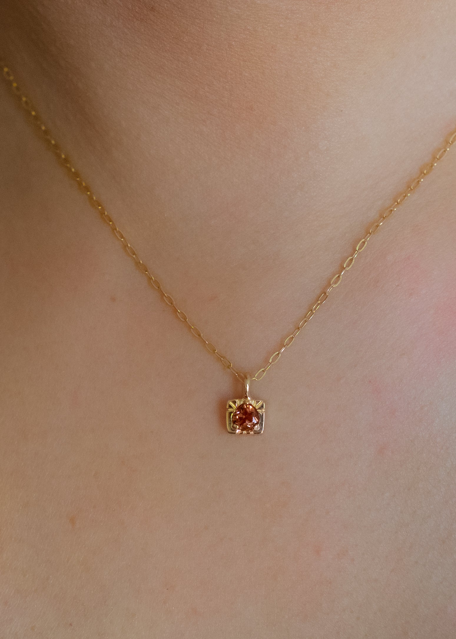 The fire of inspiration ignites with a single spark. Named after the Greek goddess of the hearth, the Vesta necklace features an engraved box-shaped gold charm with a tourmaline stone that glimmers like sacred embers–a piece that glows with promise and warmth. 