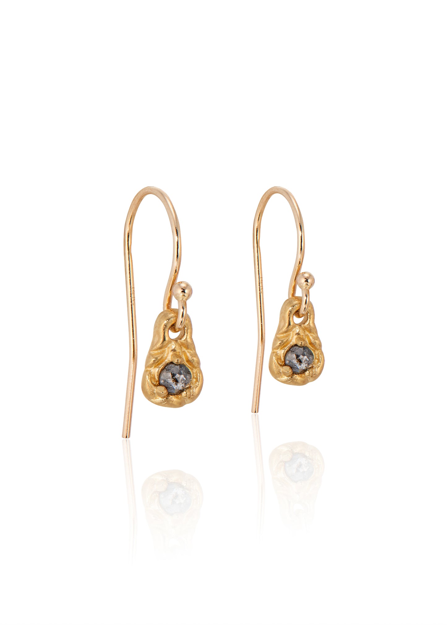 Inspiration, found. These delicate earrings gleam in hand-carved gold, their intricate pattern playing up the rose cut diamonds that shine from their center–a beacon for the Muses to bestow knowledge and creativity.