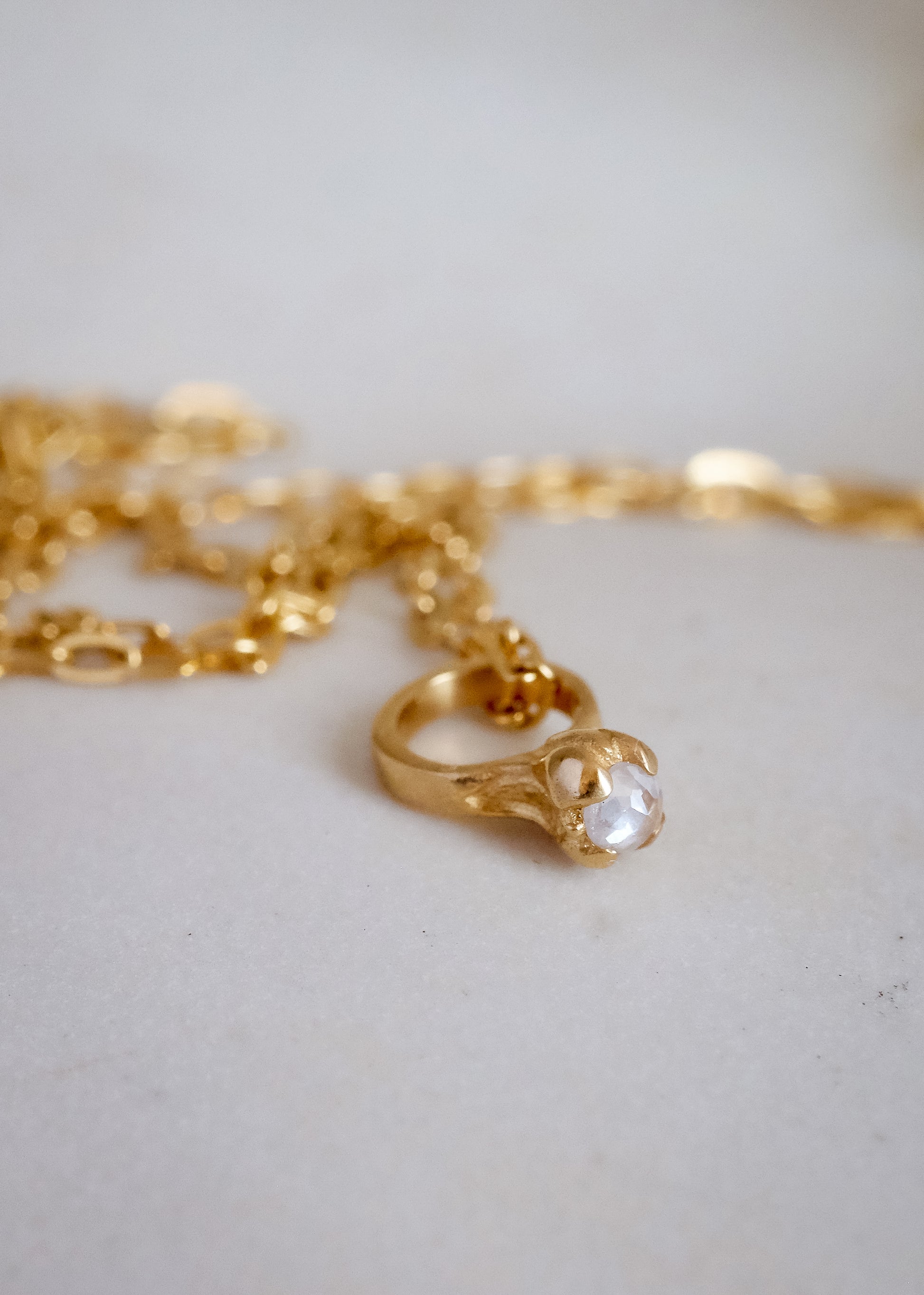Inspired by a set of rings purchased for a childhood crush, the Bitty Diamond Ring necklace features a delicate gold ring-shaped pendant, hand-crafted with intricate detail to reveal a stunning diamond crown. Perfect for celebrating new motherhood, sisterhood, friendship or love in bloom, the Bitty captures the magic of innocent childhood days, infused now with refined sophistication. 