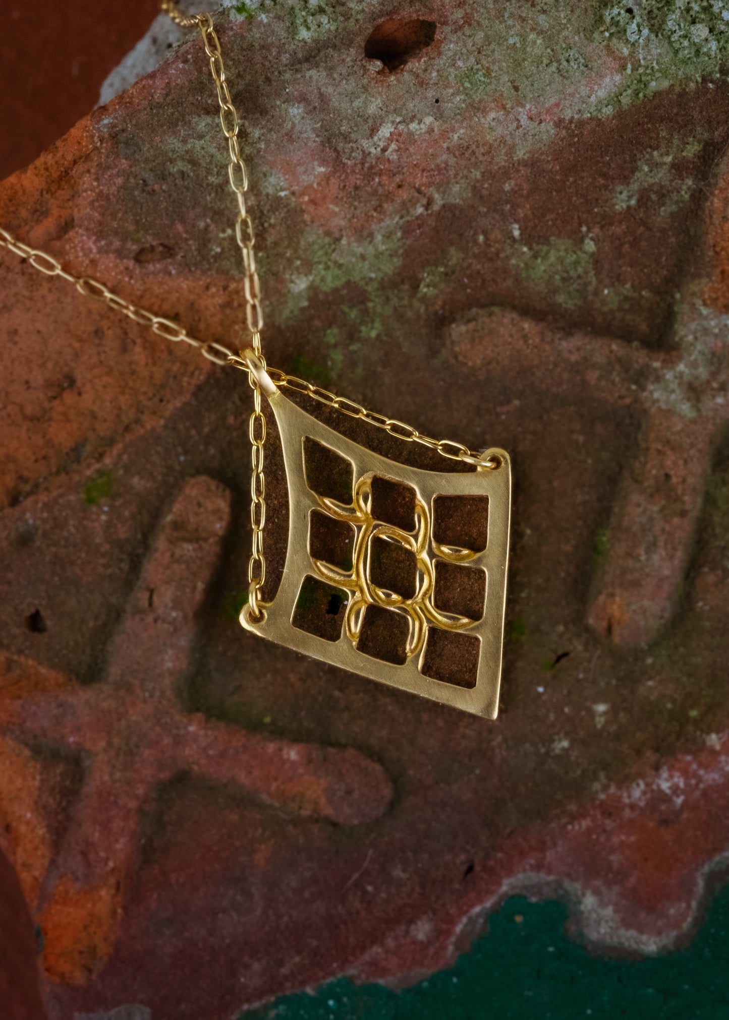 As formidable as the princess for which it is named. With its detailed gold lattice work, the Petite Shera necklace is a smaller version of the Shera necklace. A balance of delicate, bold and eye-catching, this is an empowering piece that makes a statement.