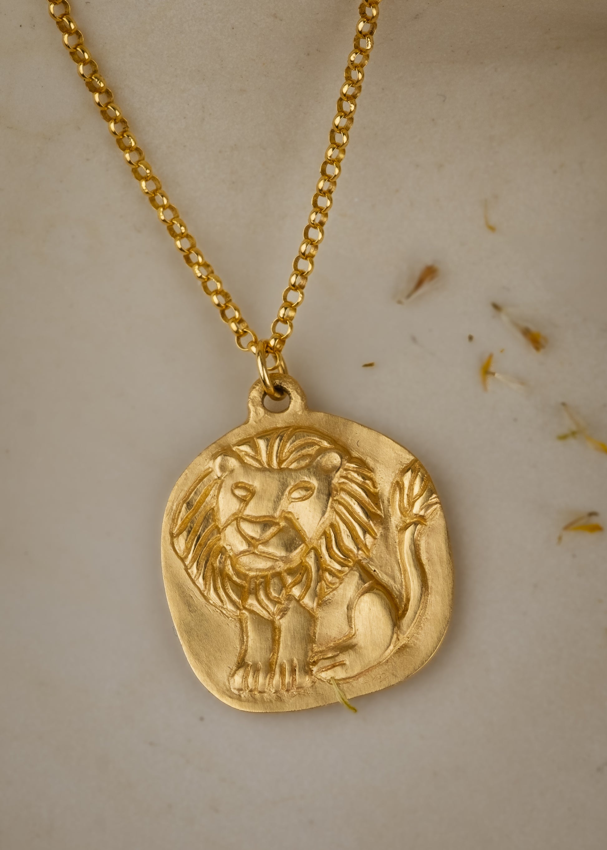 The fifth sign of the Zodiac, fire sign Leo is a natural leader, strong and creative in their approach to the world. A hand-carved, whimsical-yet-mighty little lion graces this pendant, creating a necklace that captures the power of the celestial sky. 