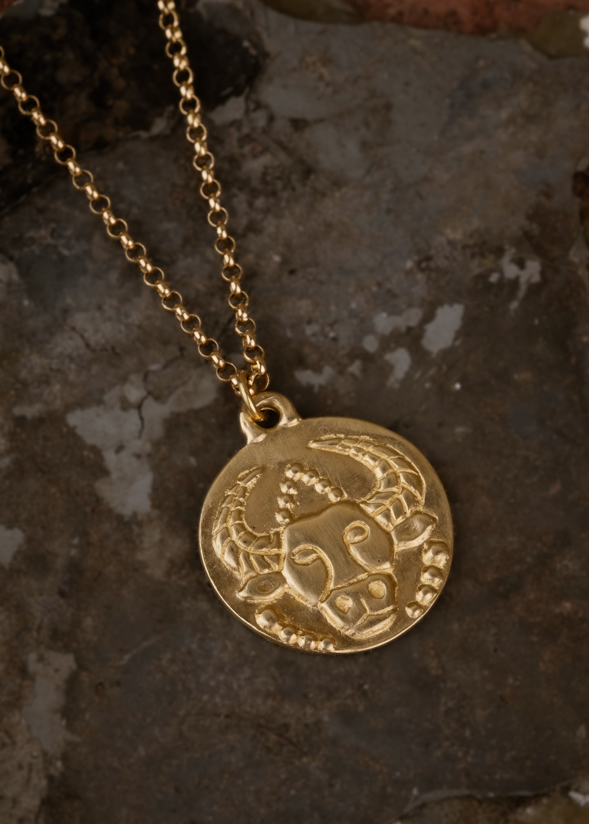 The second sign of the Zodiac, Earth sign Taurus seeks beauty and gives love fearlessly. A hand-carved bull, spiritual and wise, graces this pendant—creating a necklace that captures the power of the celestial sky. 