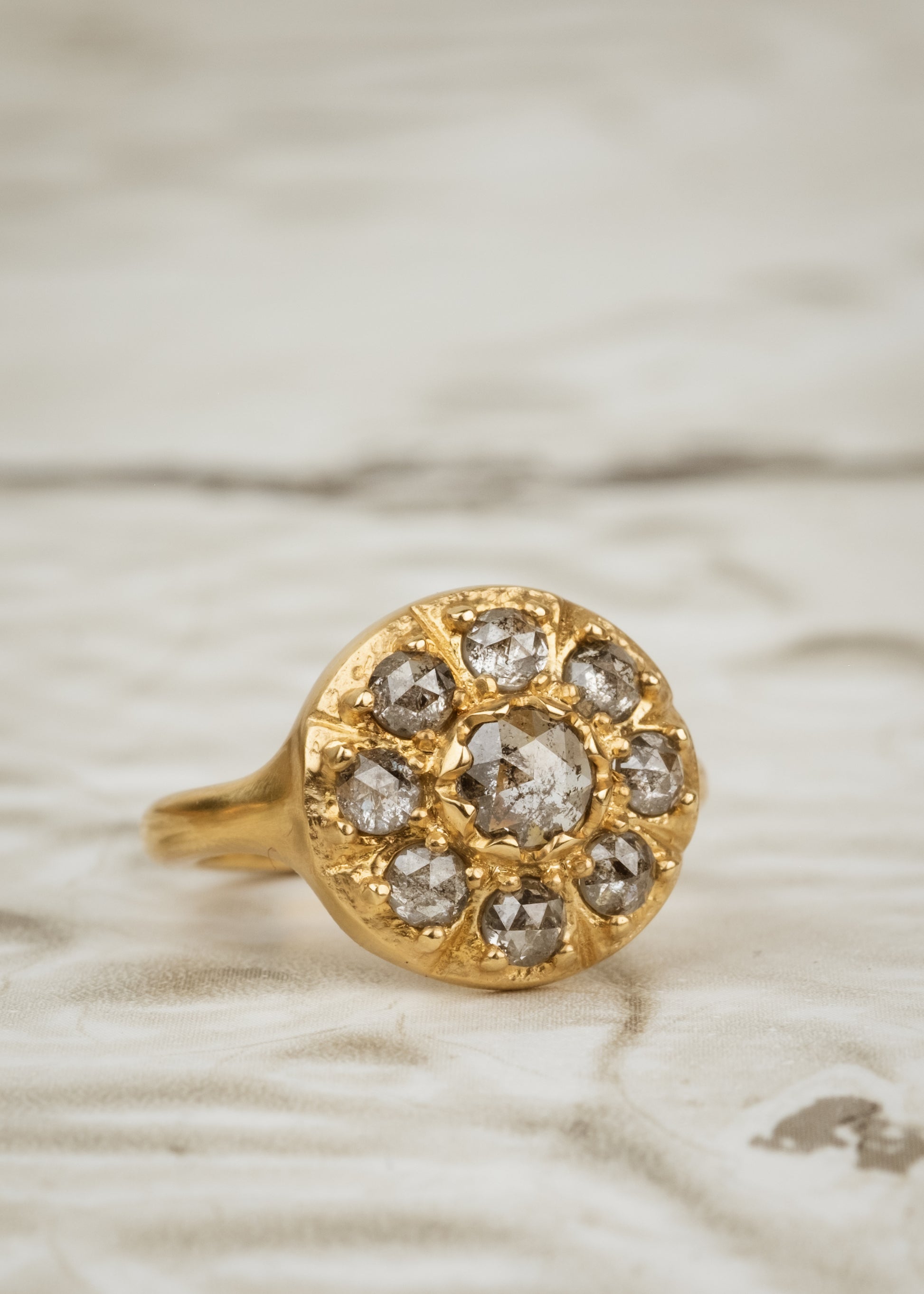 Capturing the richness and romance of its eponymous era, the Georgian ring boasts an exquisite arrangement of rose cut diamonds that celebrates the marriage between gold and stone. As timeless as it is beautiful, this piece is an instant heirloom—classic, ornate and otherworldly.