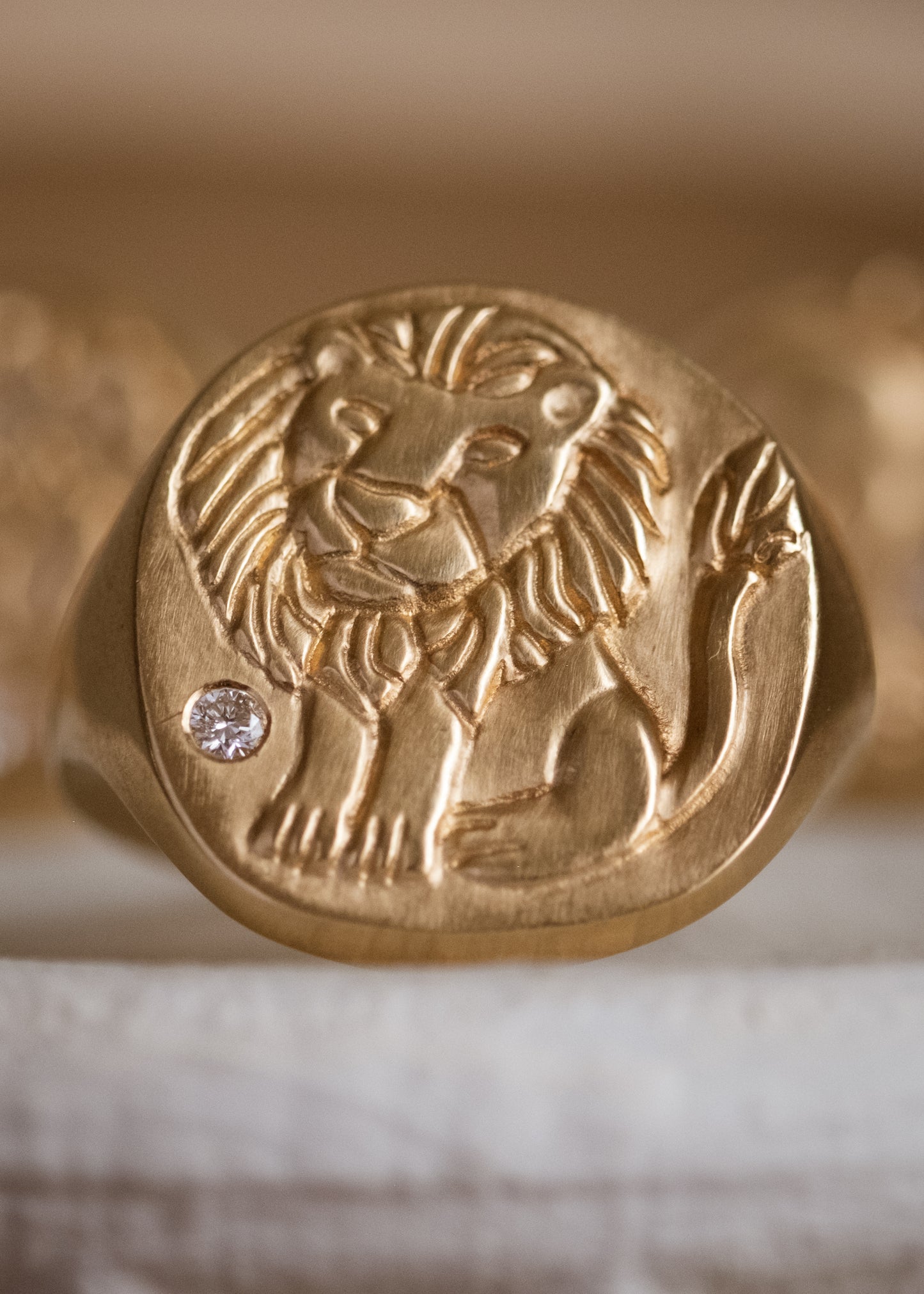 The fifth sign of the Zodiac, fire sign Leo is a natural leader, strong and creative in their approach to the world. A hand-carved, whimsical yet mighty little lion is accented with a precious diamond for a ring that captures the power of the celestial sky. 