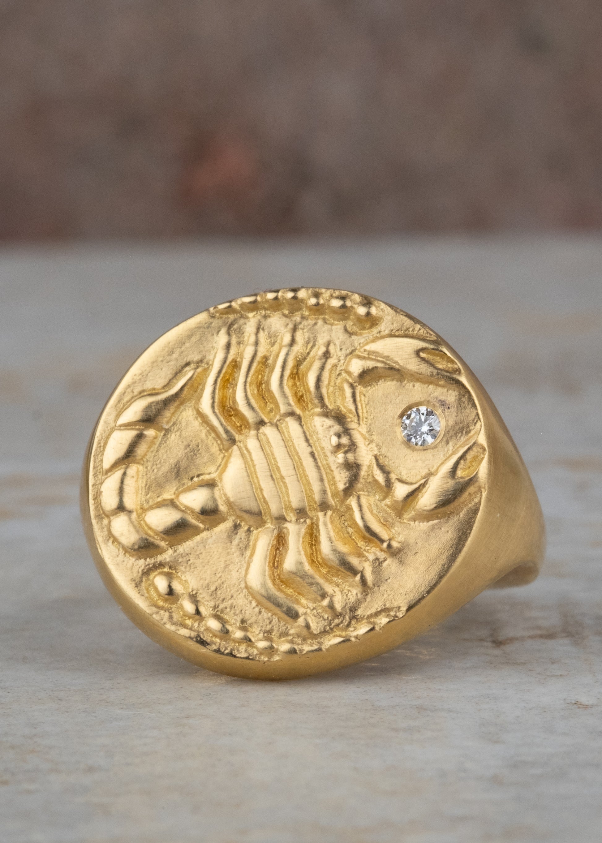 The eighth sign of the Zodiac, water sign Scorpio is a passionate truth-seeker who leads with decisiveness. A hand-detailed, fierce yet whimsical scorpion is accented with a precious diamond for a ring that captures the power of the celestial sky.