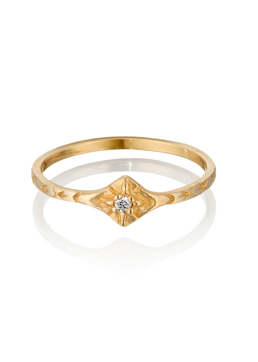The smoke from a wood burning fire. A brilliant point of light piercing an obsidian sky. The Starlite ring captures the beauty of a frigid winter night. A brilliant diamond gleams against a delicate gold band that’s been intricately hand-carved with stars–a piece as timeless as the constellations themselves.